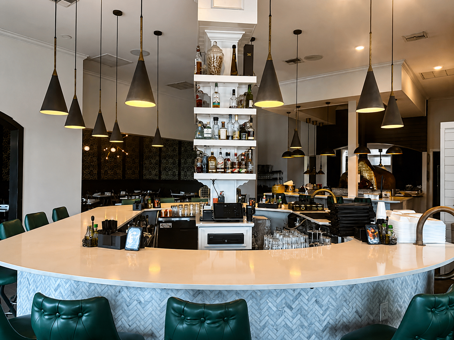Bar view with pendant lighting and back bar at Romacelli